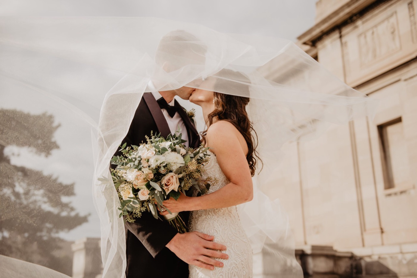 A couple in the gardens on their wedding day
